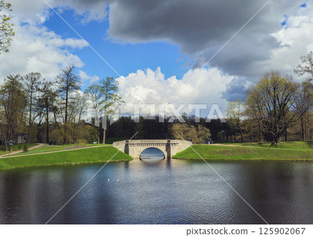 spring landscape with lake and old stone bridge spring landscape with lake and old stone bridge 125902067