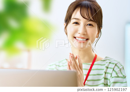 Business woman in telework to operate a personal computer 125902197