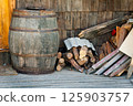 Rustic Barrel and Woodpile 125903757