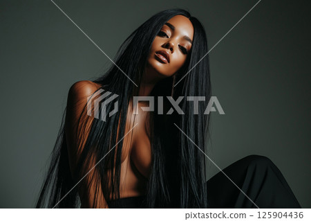 Glamorous woman posing in a professional photography studio with elegant lighting. Photosession, naked, nude, erotic modern portraits 125904436