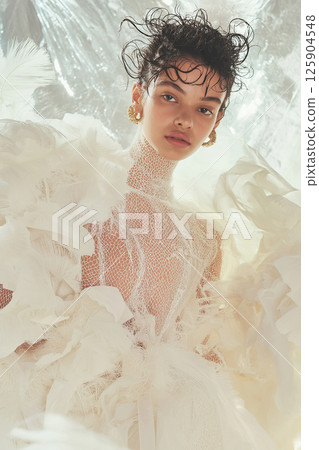 Stylish portrayal of a model featuring sophisticated vintage-inspired fashion and dynamic movement. Elegant woman in vintage styled attire with dramatic flowing accents 125904548