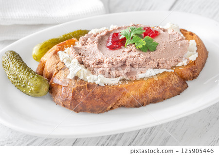 Gourmet sandwich layered with pate, cranberry jam, and cream cheese Gourmet sandwich layered with pate, cranberry jam, and cream cheese 125905446