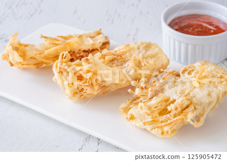Crispy Battered Enoki Mushrooms Served With Sweet Chili Dipping Sauce Bowl Crispy Battered Enoki Mushrooms Served With Sweet Chili Dipping Sauce Bowl 125905472