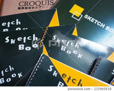 A large number of sketchbooks and sketch pads A large number of sketchbooks and sketch pads 125905619