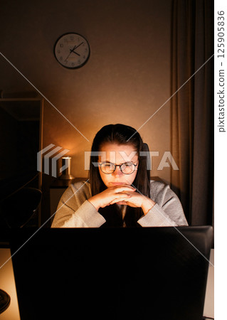 Tired new entrepreneur trying to deal with business problems. Upset businesswoman feeling tired of unsuccess selling products. Woman with laptop. Online business concept. Tired new entrepreneur trying to deal with business problems. Upset businesswoman feeling tired of unsuccess selling products. Woman with laptop. Online business concept. 125905836