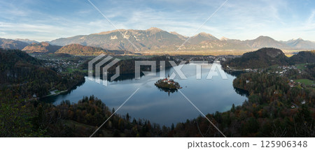 Alpine scenery with lake, island and church in the middle and mountains in backdrop, Bled, Slovenia Alpine scenery with lake, island and church in the middle and mountains in backdrop, Bled, Slovenia 125906348