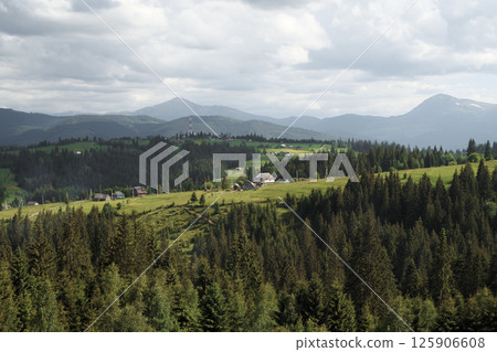 Bright hilly area around the farm. Picturesque day and great scene. Location Carpathians, Ukraine, Europe. Ecology protection concept. Discover the beauty of the world. 125906608