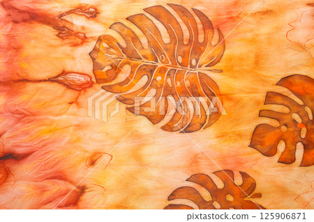 abstract pattern on silk fabric texture in yellow and brown tones abstract pattern on silk fabric texture in yellow and brown tones 125906871