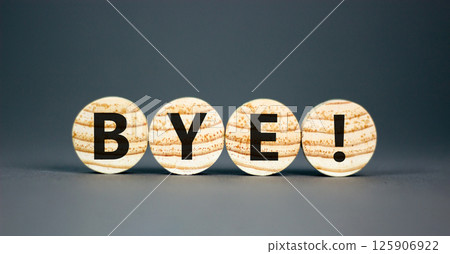 Bye symbol. Concept word Bye on beautiful wooden circles. Beautiful grey table grey background. Business and bye concept. Copy space. 125906922