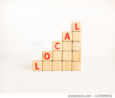 Local symbol. Concept word Local on beautiful wooden blocks. Beautiful white table white background. Business lifestyle local concept. Copy space. 125906932
