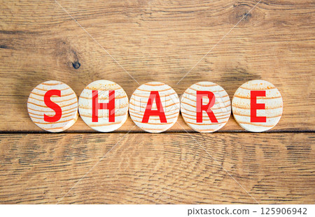 Share symbol. Concept word Share on beautiful wooden circles. Beautiful wooden table wooden background. Business lifestyle share concept. Copy space. Share symbol. Concept word Share on beautiful wooden circles. Beautiful wooden table wooden background. Business lifestyle share concept. Copy space. 125906942