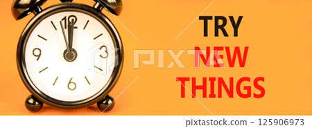 Try new things symbol. Concept words Try new things on beautiful orange paper. Alarm clock. Beautiful orange paper background. Business motivational lifestyle try new things concept. Copy space. Try new things symbol. Concept words Try new things on beautiful orange paper. Alarm clock. Beautiful orange paper background. Business motivational lifestyle try new things concept. Copy space. 125906973