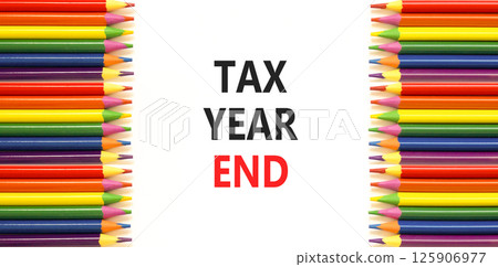 Tax year end symbol. Concept words Tax year end on beautiful white paper. Beautiful white background. Colored pencils. Business tax year end concept. Copy space. 125906977