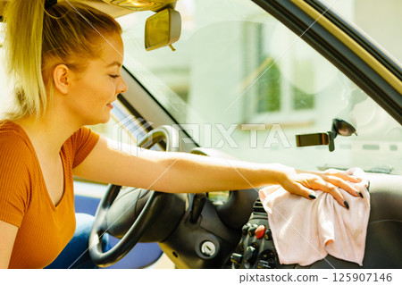 Cleaning car interior with cloth Cleaning car interior with cloth 125907146