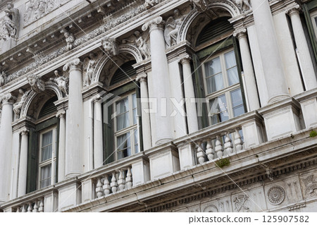Historic Building Facade with Sculptures and Columns 125907582