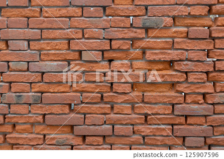 Textured Orange Brick Wall Background 125907596