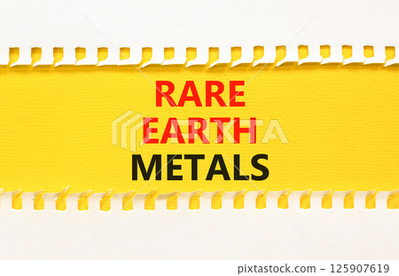 Rare earth metals symbol. Concept words Rare earth metals on beautiful yellow paper on clothespin. Beautiful white paper background. Business and rare earth metals concept. Copy space. Rare earth metals symbol. Concept words Rare earth metals on beautiful yellow paper on clothespin. Beautiful white paper background. Business and rare earth metals concept. Copy space. 125907619