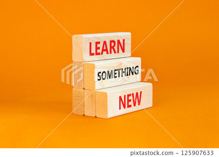Learn something new symbol. Concept words Learn something new on beautiful block. Beautiful orange table orange background. Business motivational lifestyle learn something new concept Copy space Learn something new symbol. Concept words Learn something new on beautiful block. Beautiful orange table orange background. Business motivational lifestyle learn something new concept Copy space 125907633