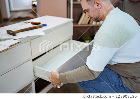 Crafting a beautiful drawer for a cozy home workspace in the afternoon Crafting a beautiful drawer for a cozy home workspace in the afternoon 125908150