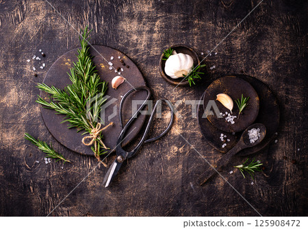 Rosemary, garlic, salt and pepper. Rosemary, garlic, salt and pepper. 125908472