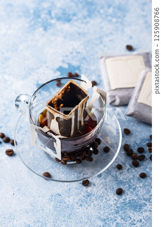 Freshly brewed drip coffee in glass cup Freshly brewed drip coffee in glass cup 125908766
