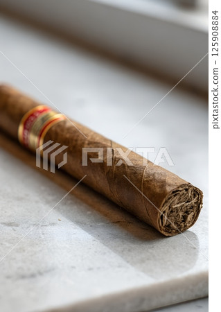 Close-up of a premium hand-rolled luxury cigar with rich tobacco leaves 125908884
