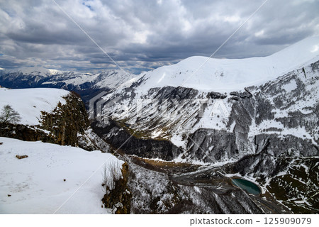 Snowcapped peaks of Caucasus mountains along the Georgian Military Road, major route from Georgia to Russia 125909079