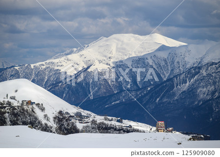 Snowcapped peaks of Caucasus mountains along the Georgian Military Road, major route from Georgia to Russia Snowcapped peaks of Caucasus mountains along the Georgian Military Road, major route from Georgia to Russia 125909080