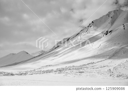 Snowcapped peaks of Caucasus mountains along the Georgian Military Road, major route from Georgia to Russia 125909086
