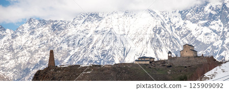 Snowcapped peaks of Caucasus mountains along the Georgian Military Road, major route from Georgia to Russia 125909092