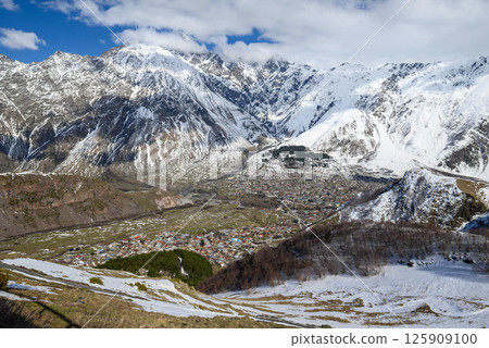 Town of Stepantsminda in Caucasus mountains along the Georgian Military Road, major route from Georgia to Russia 125909100