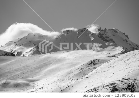 Snowcapped peaks of Caucasus mountains along the Georgian Military Road, major route from Georgia to Russia 125909102