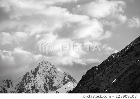 Snowcapped peaks of Caucasus mountains along the Georgian Military Road, major route from Georgia to Russia 125909108
