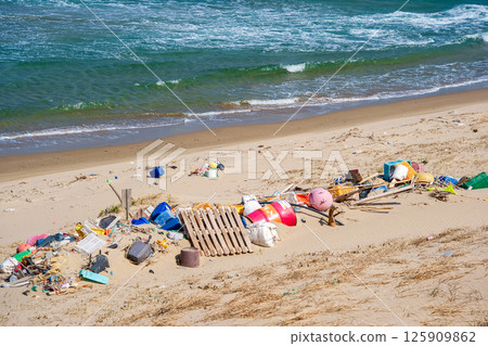 Drifting garbage washed up on the beach Drifting garbage washed up on the beach 125909862