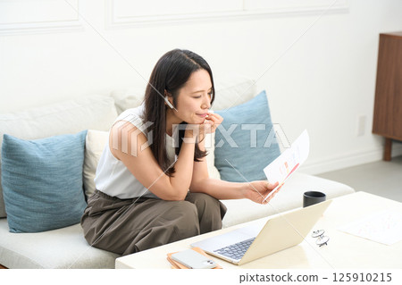 A woman looking seriously at a computer screen Failure Trouble Mistake A woman looking seriously at a computer screen Failure Trouble Mistake 125910215