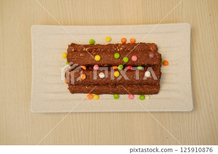 Chocolate Coated Cereal Bars on Elegant Plate Chocolate Coated Cereal Bars on Elegant Plate 125910876