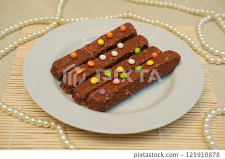 Artistic Food Arrangement with Chocolate Snack and Pearls Artistic Food Arrangement with Chocolate Snack and Pearls 125910878