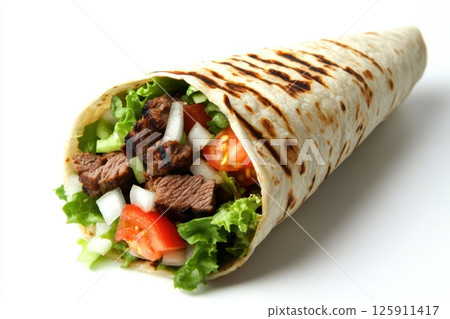 Close-up of a freshly made beef burrito filled with colorful ingredients like cheese, tomatoes, and cilantro against a plain white background. 125911417