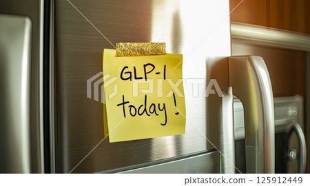 Reminder note on refrigerator for GLP-1 medication administration today health management concept 125912449