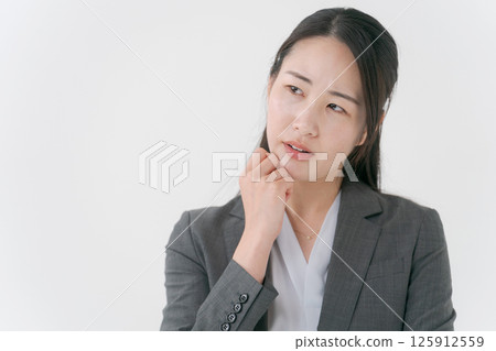 Business woman in troubled look Business woman in troubled look 125912559
