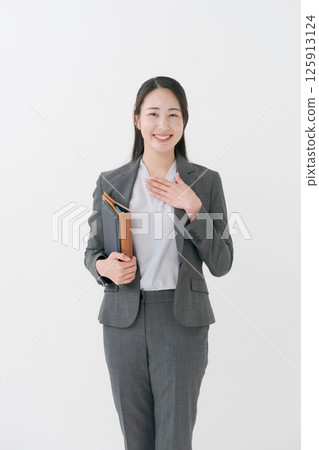 Businesswoman holding a file Businesswoman holding a file 125913124