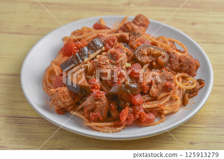 Tomato pasta with chicken and eggplant Tomato pasta with chicken and eggplant 125913279