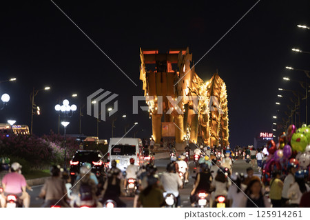 far view of dragon bridge in da nang. This modern bridge crosses the Han River at the Le Dinh Duong, Bach Dang traffic circle 125914261
