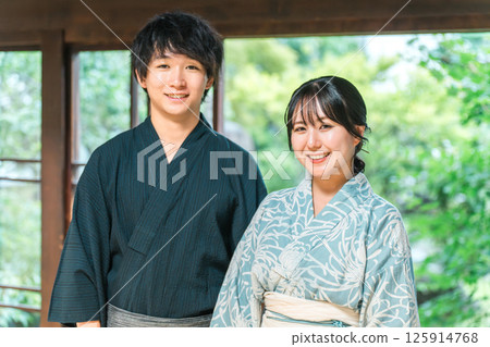 Asian couple in yukata sitting on the veranda of a Japanese house Asian couple in yukata sitting on the veranda of a Japanese house 125914768