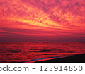 a fiery red sunrise 125914850