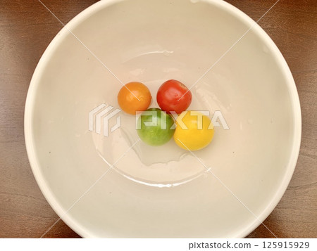 Stock Photo: Colorful fresh cherry tomatoes 125915929