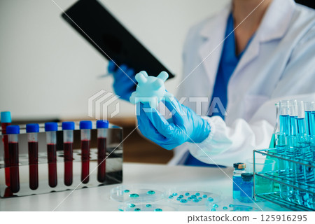 Coronavirus COVID-19 medical test vaccine research and development concept.in a chemistry lab. Coronavirus COVID-19 medical test vaccine research and development concept.in a chemistry lab. 125916295