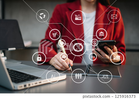Businesswoman using smartphone and laptop and tablet computer with Digital marketing media in virtual icons 125916373