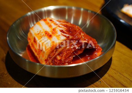 Close-Up of a Delicious Kimchi Dish on a Golden Tray Close-Up of a Delicious Kimchi Dish on a Golden Tray 125916434