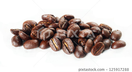 Pile of Dark brown roasted coffee beans isolated on white background, Raw processed food for drinks refreshment Pile of Dark brown roasted coffee beans isolated on white background, Raw processed food for drinks refreshment 125917288